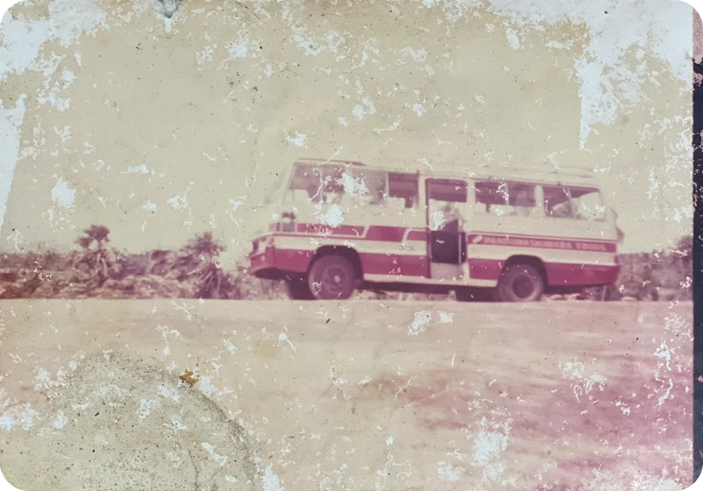 The original coach on the road, with Panduwasnuwara Tours painted along its side